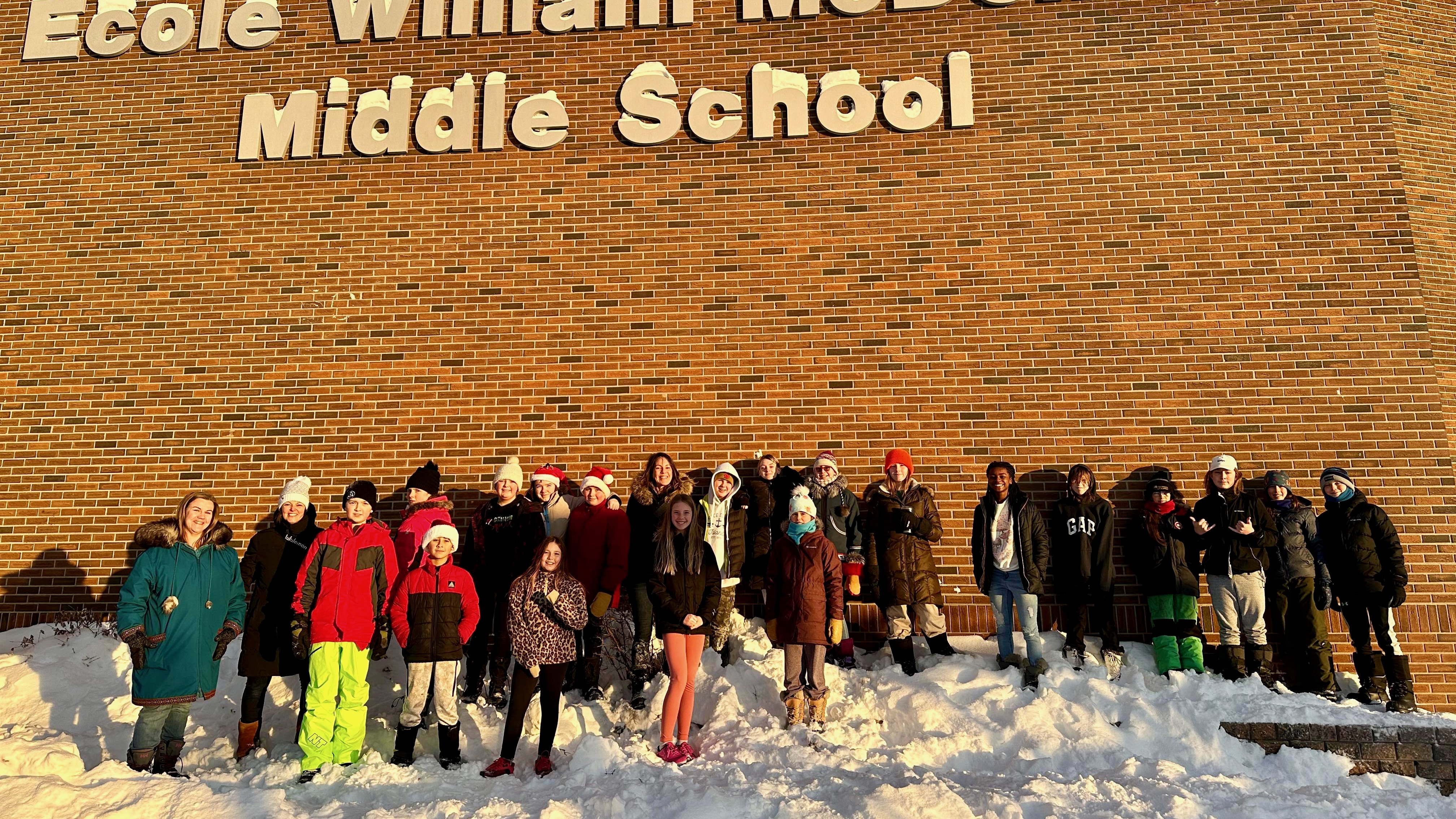 William McDonald Middle School students in front of the wall that will eventually hold their mural