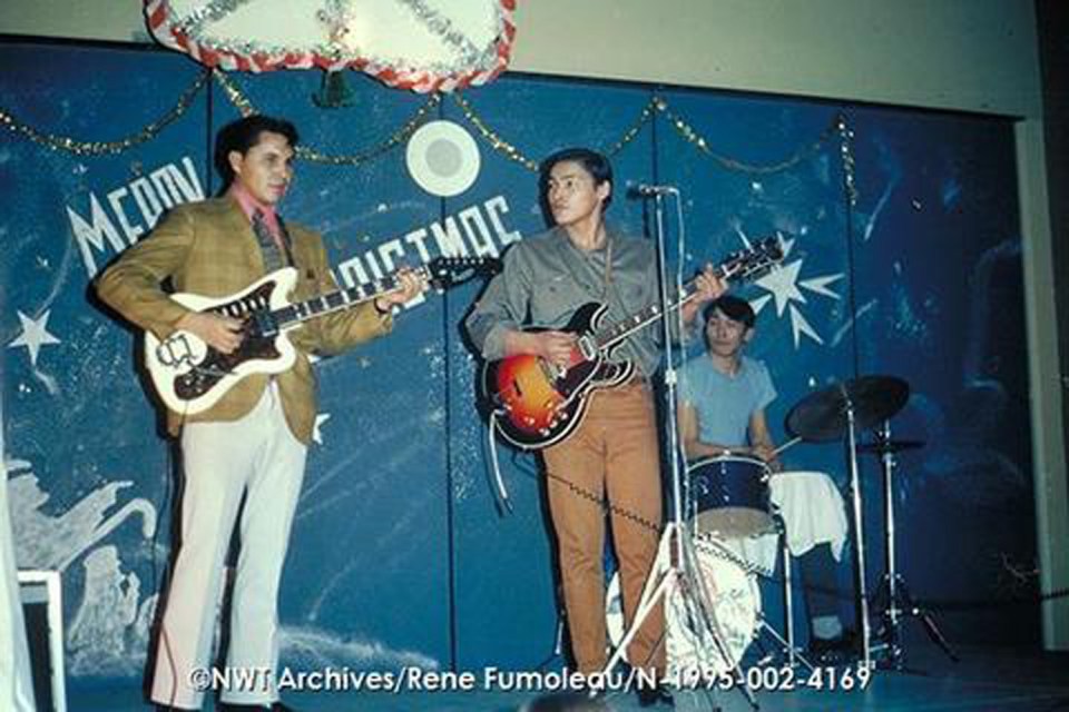 George Mandeville performing a Christmas concert, possibly at Yellowknife's jail, in 1971