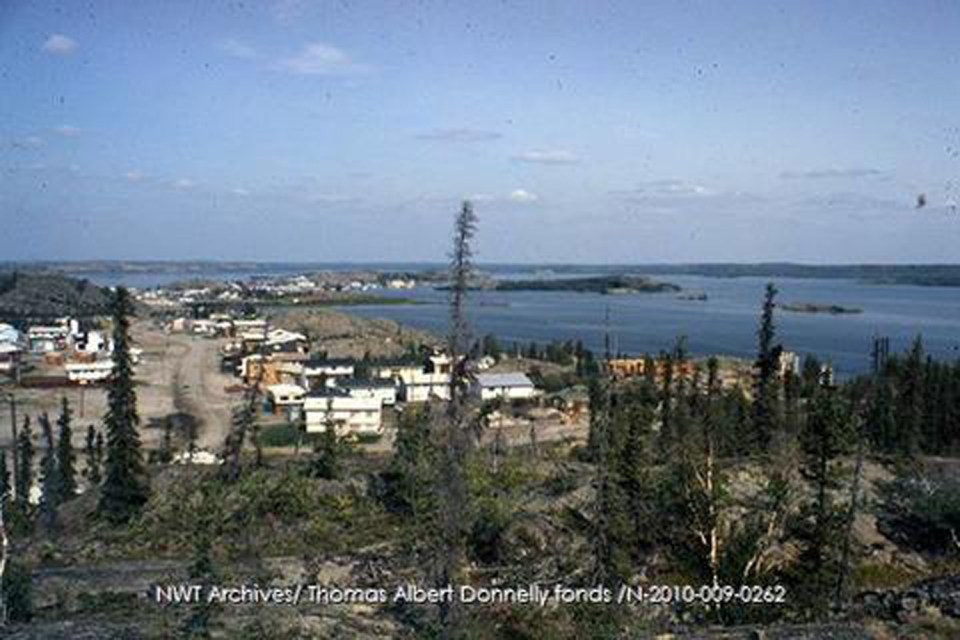 Yellowknife's School Draw Avenue as a dirt road in 1973, with Latham Island in the distance