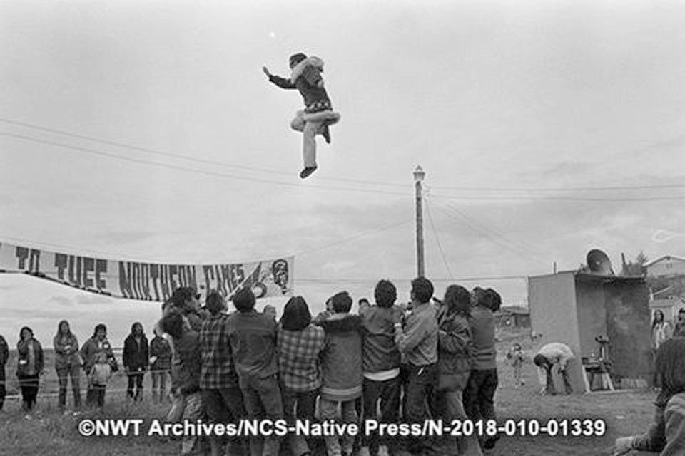 Maggie Allen, from Barrow, Alaska, competes in women's blanket toss at the Northern Games in Fort Good Hope