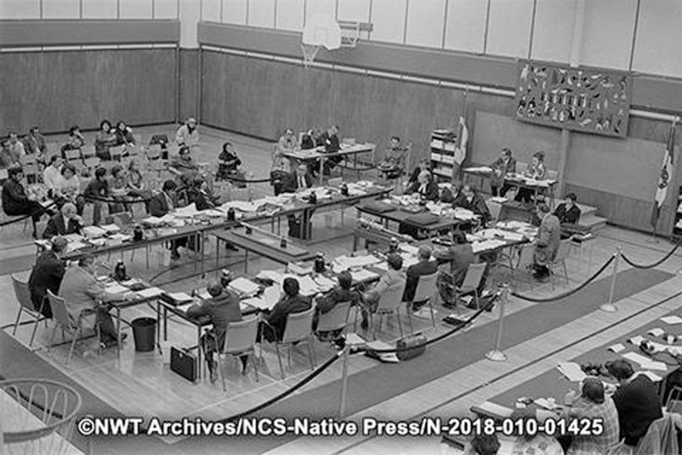 Appointed members of the territorial council, the forerunner of today's Legislative Assembly, sit in Inuvik in October 1973