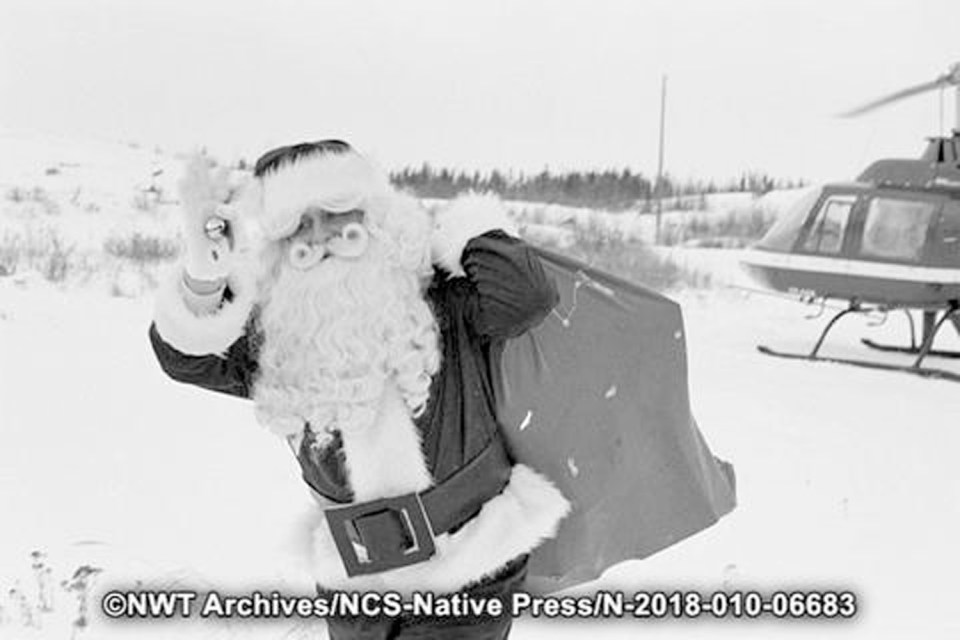 Santa arrives by helicopter at the 1979 Dettah Christmas party