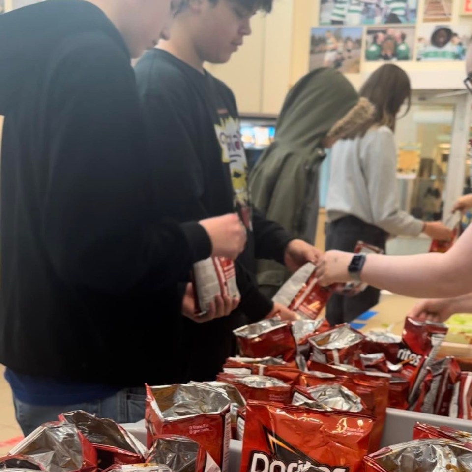 Students browse the bagged taco selection
