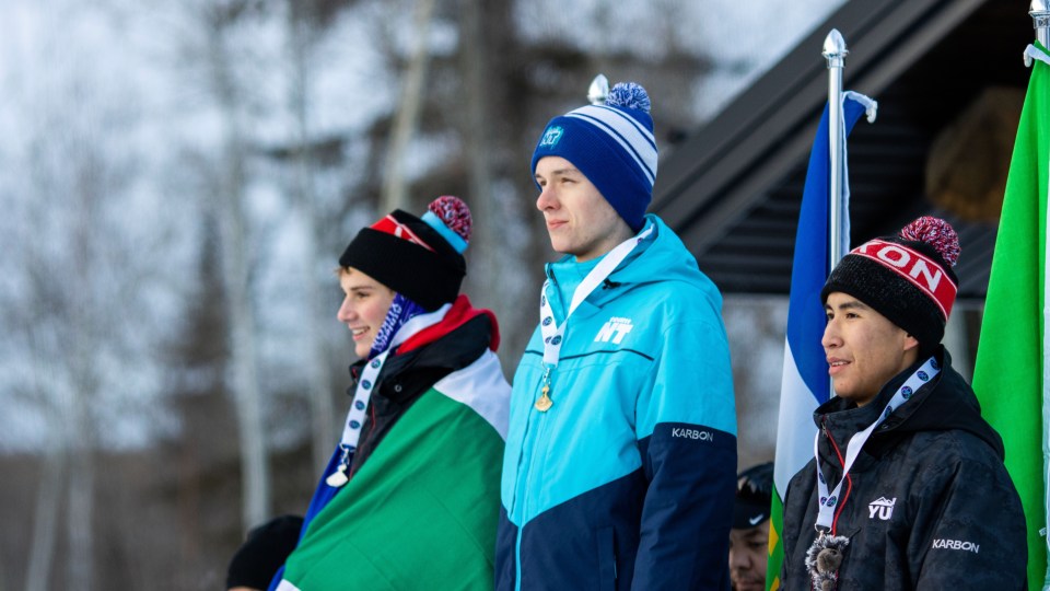 Alex Fast, centre, during his medal ceremony