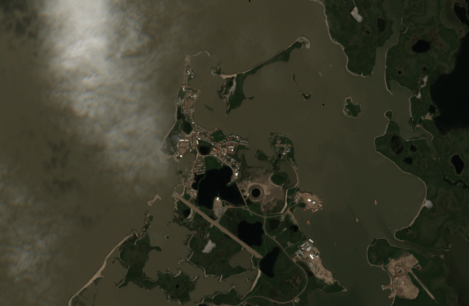 A Sentinel-2 satellite image from July 2022 shows the island, top centre, that protects Tuktoyaktuk's harbour from the worst effects of storm surge