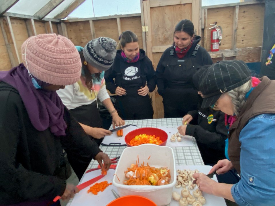 Young people working on the food tasting portion of the exhibit