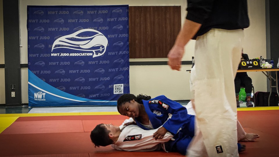 Corbin Wilson, left, and Jaana Lyssa-Sutherland compete at judo's Arctic Open