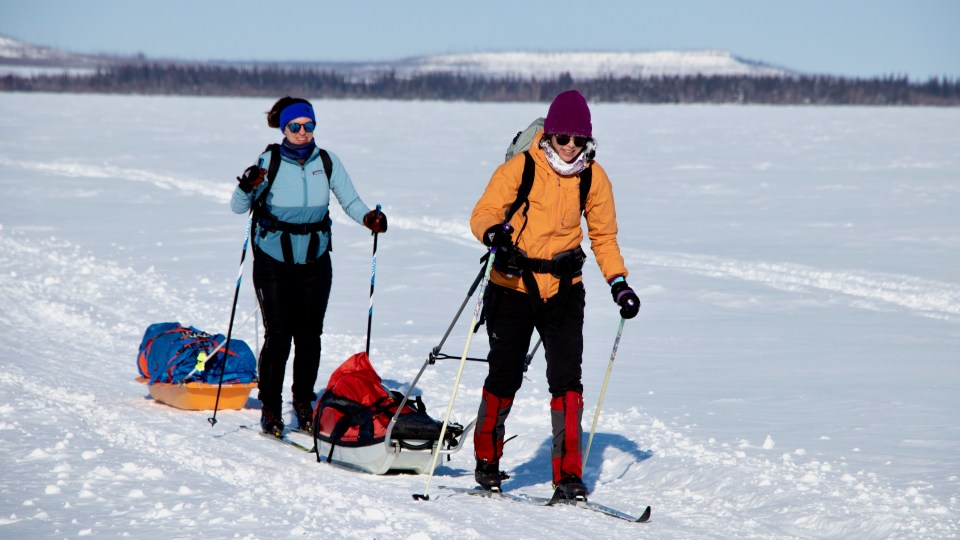 Nicola Langille, left, and Sara Wong mid-ski