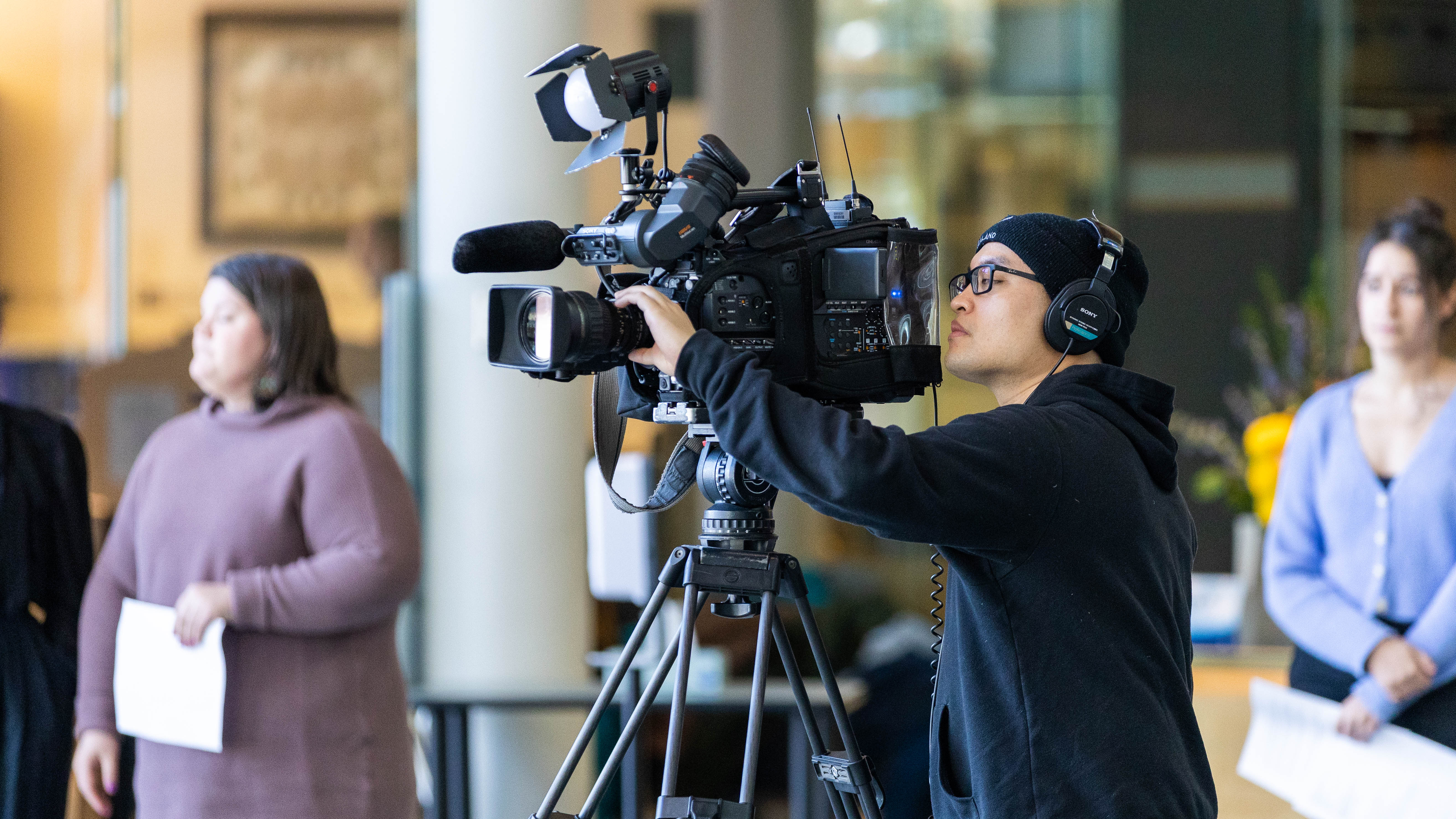 A CBC camera operator at the NWT legislature in March 2023