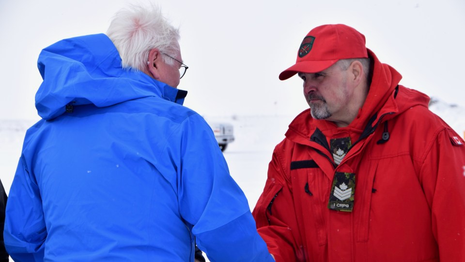Nunakput MLA Jackie Jacobson (right), a sergeant in the Canadian Rangers, greets Frank-Walter Steinmeier