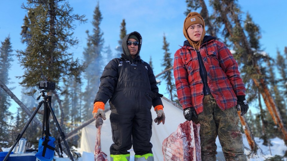Elder guide Keith Colin and Ethan Koe shoot and harvest a caribou at Curtain Mountain