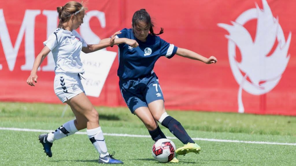 Kolbi Bernhardt, right, plays for the Northwest Territories at the 2017 Canada Games
