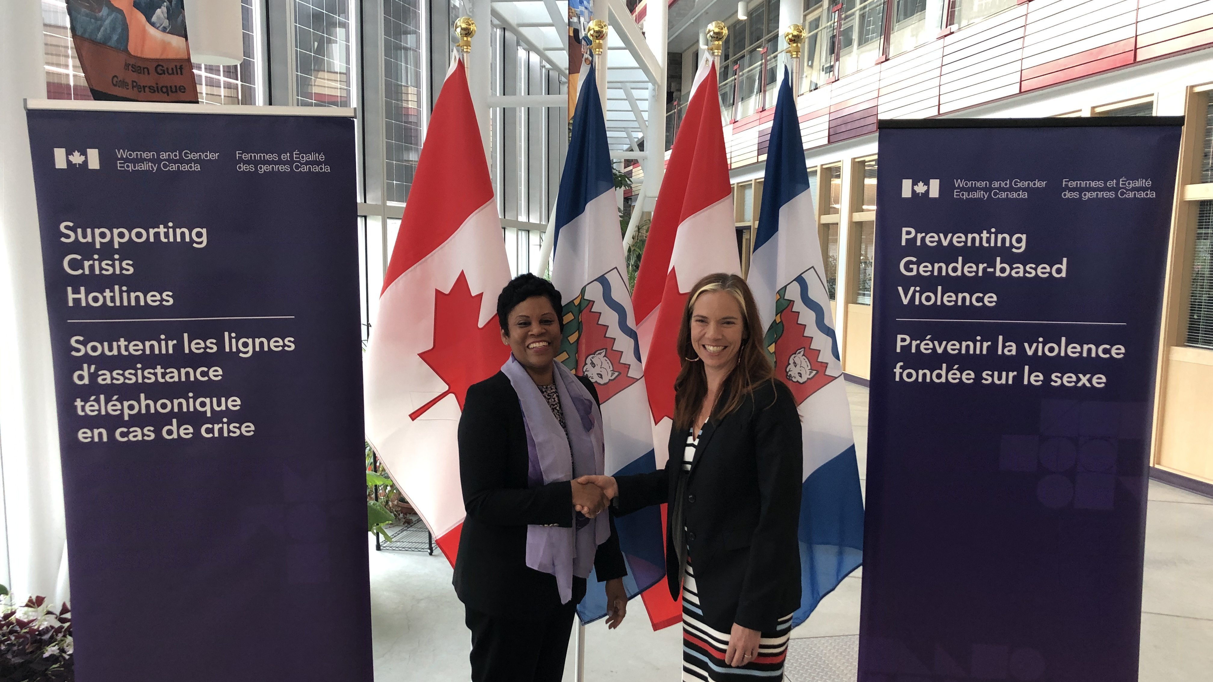 Federal and territorial women's ministers Marci Ien, left, and Caroline Wawzonek at an announcement in Yellowknife on May 24, 2023