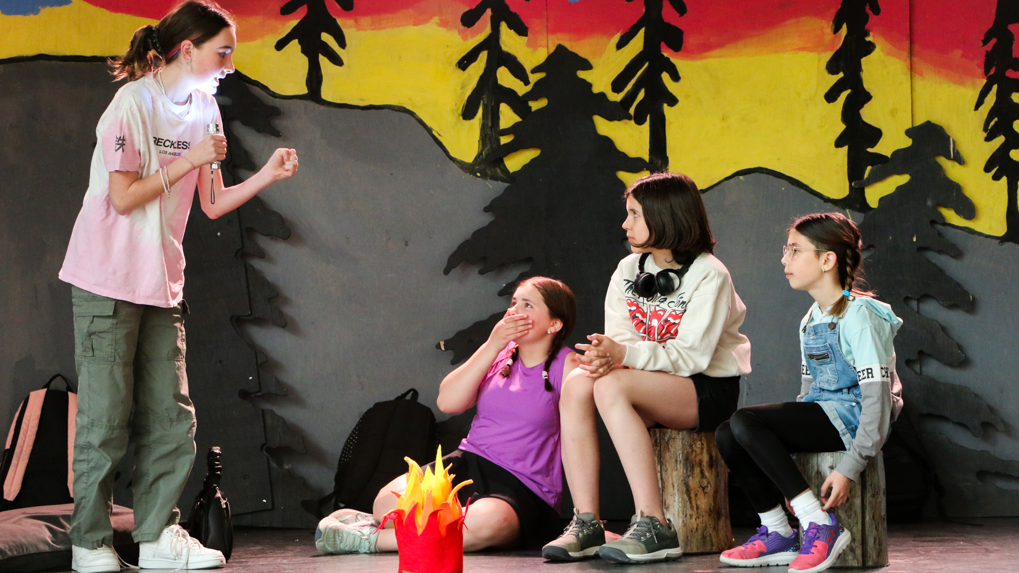Léa Marcoux, left, and students of Le Gang de 6 et la Forêt des Histoires at a dress rehearsal for the play