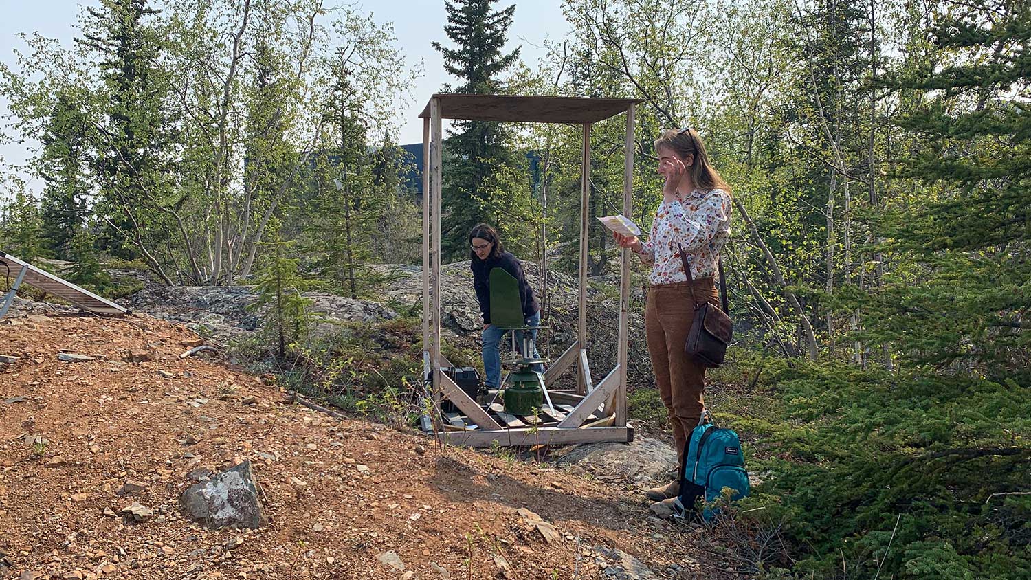 Laura Meinert, left and Johanna Stewart, right, collect a fungal spore sample from the urban Yellowknife site of the Lifeplan study