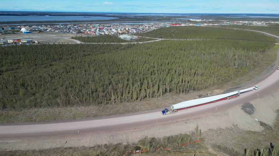 A giant blade is hauled past Inuvik to the site of a new wind turbine. David Stewart/Inuvialuit Communications Society