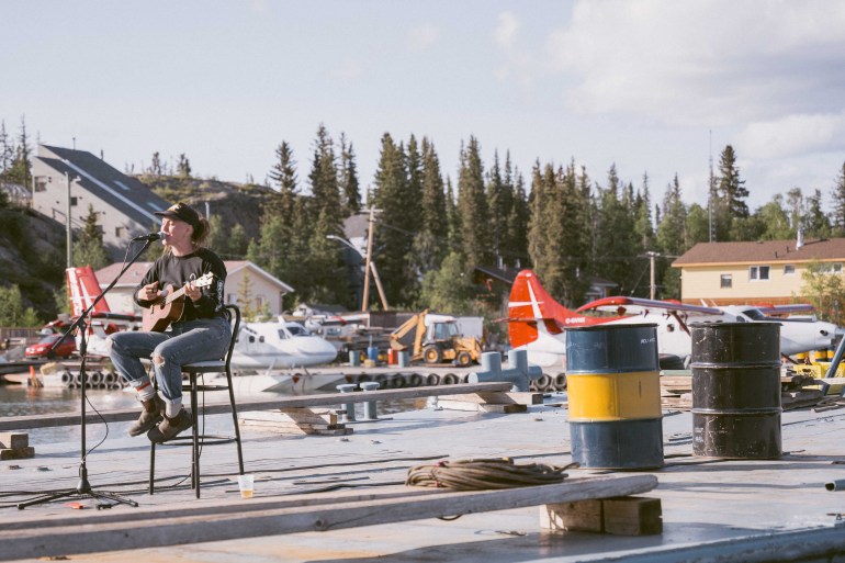 Cat McGurk performs on the Beer Barge in 2023. Sarah Pruys/Cabin Radio