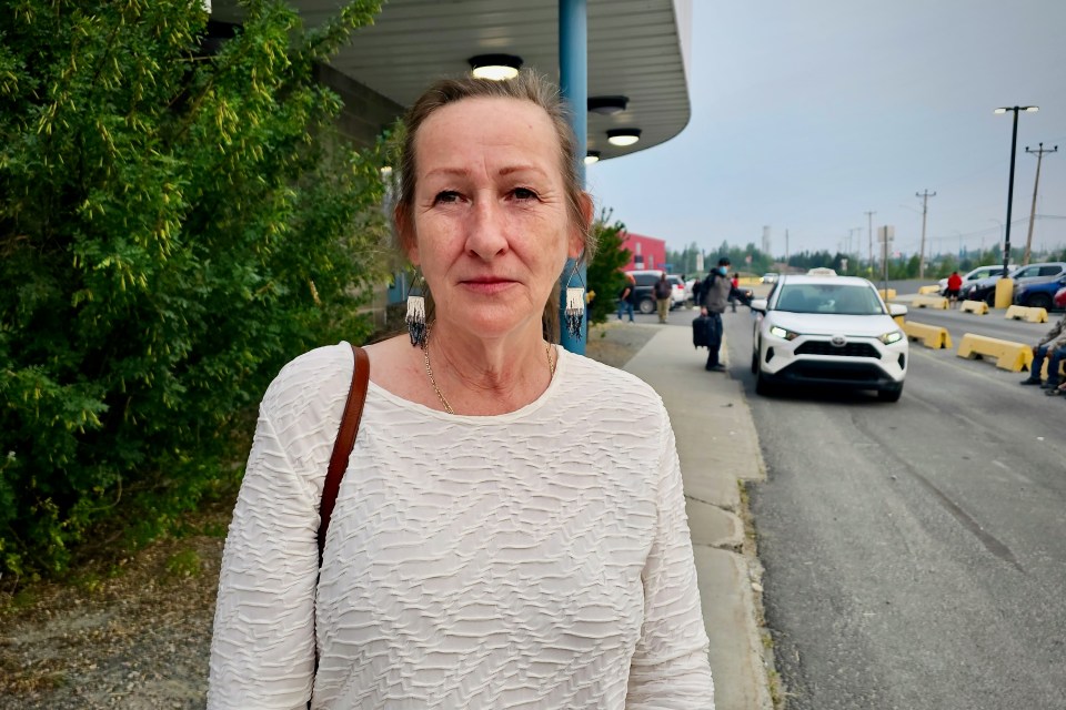 Premier Caroline Cochrane outside Yellowknife's evacuee centre on July 24, 2023. Ollie Williams/Cabin Radio