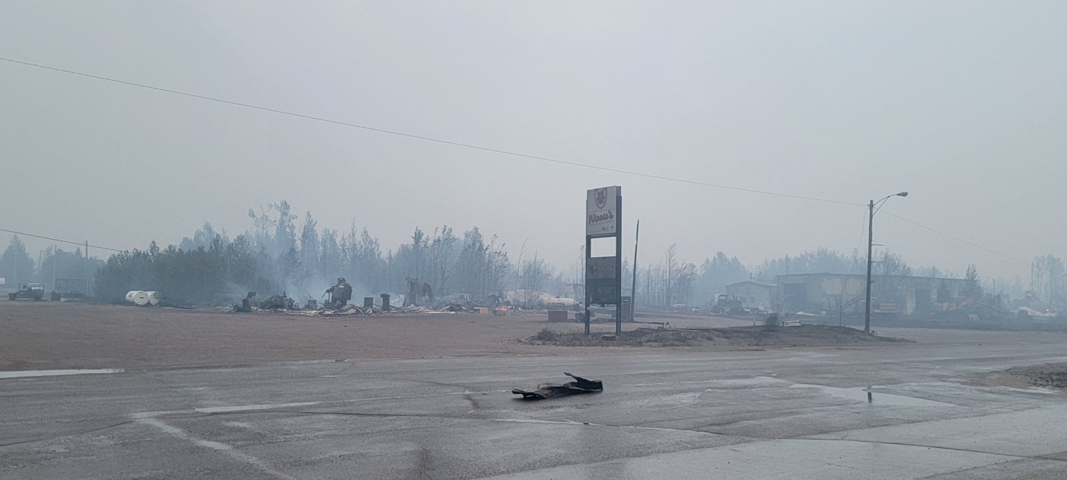 Structures smouldering in Enterprise around 5am on Monday, August 14, 2023. Photo: A G Carroll
