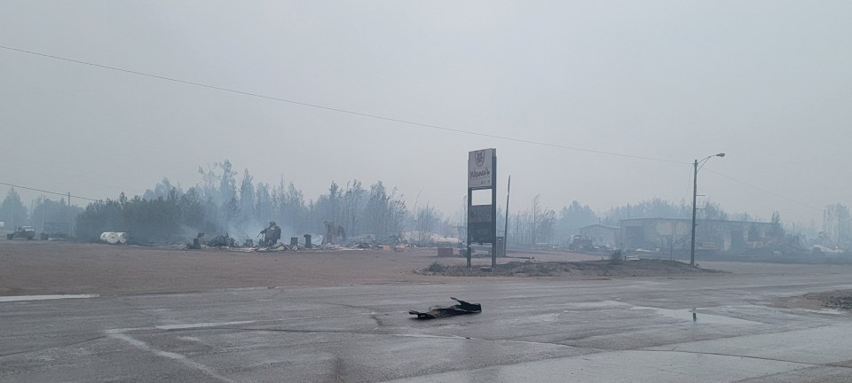 Structures smouldering in Enterprise around 5am on Monday, August 14, 2023. Photo: A G Carroll