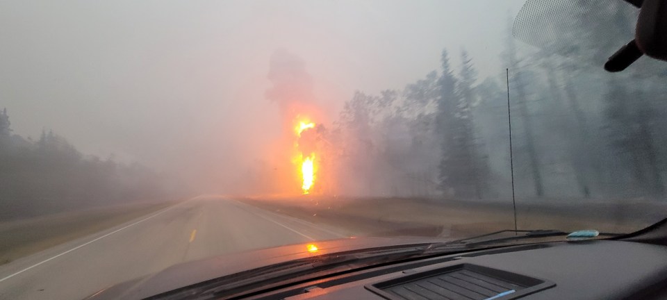 The highway between Enterprise and Louise Falls around 4am on Monday, August 14, 2023. The fire was still burning on both sides of the road. Photo: A G Carroll