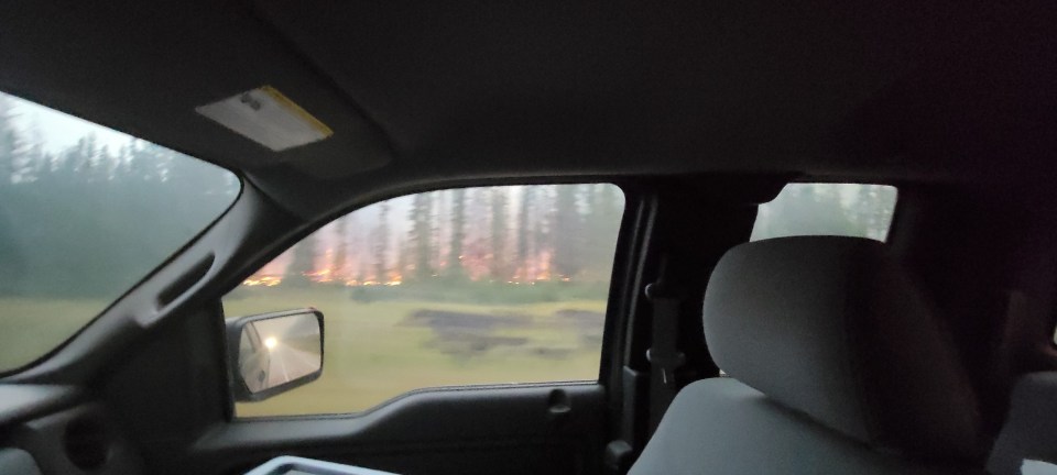 The highway between Enterprise and Louise Falls around 4am on Monday, August 14, 2023. The fire was still burning on both sides of the road. Photo: Gerard Carroll
