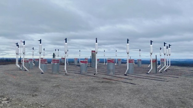 Piles (grey) and thermosyphons (white) intended to stabilize the turbine and protect permafrost. Photo: NTPC