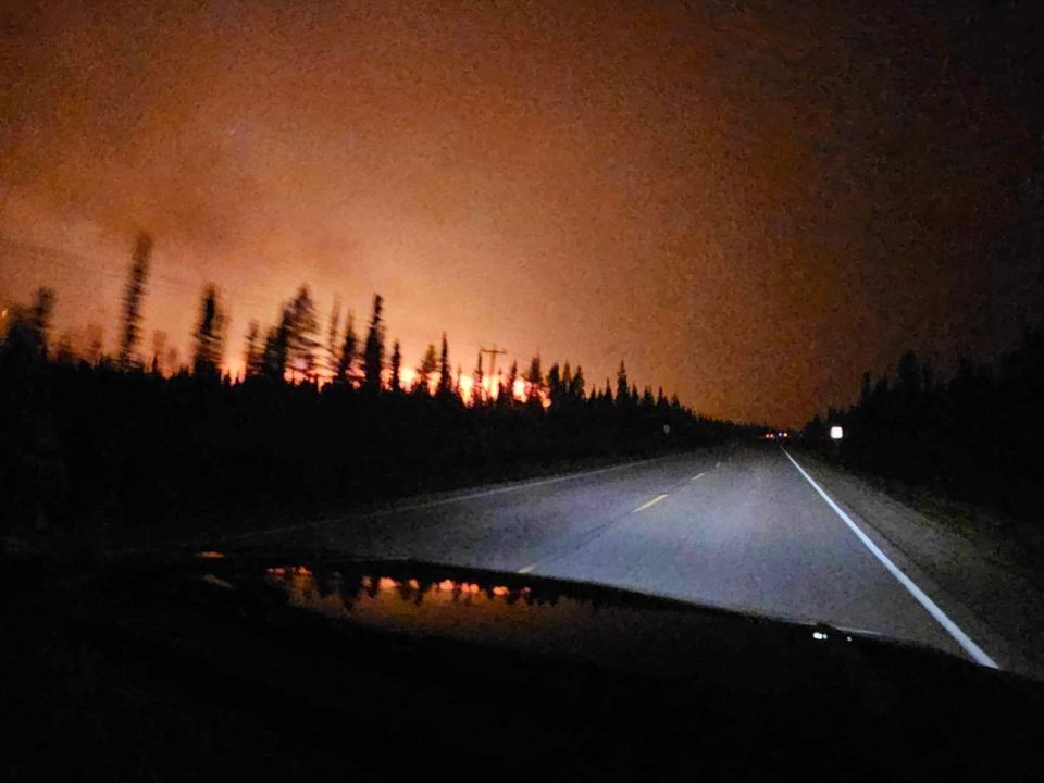 Fire SS052 in the distance on August 13, before the fire crossed the highway and closed the road between Hay River and Enterprise. April Broekaert-Glaicar/Photo