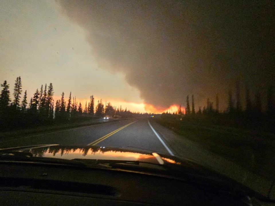 Fire SS052 in the distance on August 13, before the fire crossed the highway and closed the road between Hay River and Enterprise. April Broekaert-Glaicar/Photo