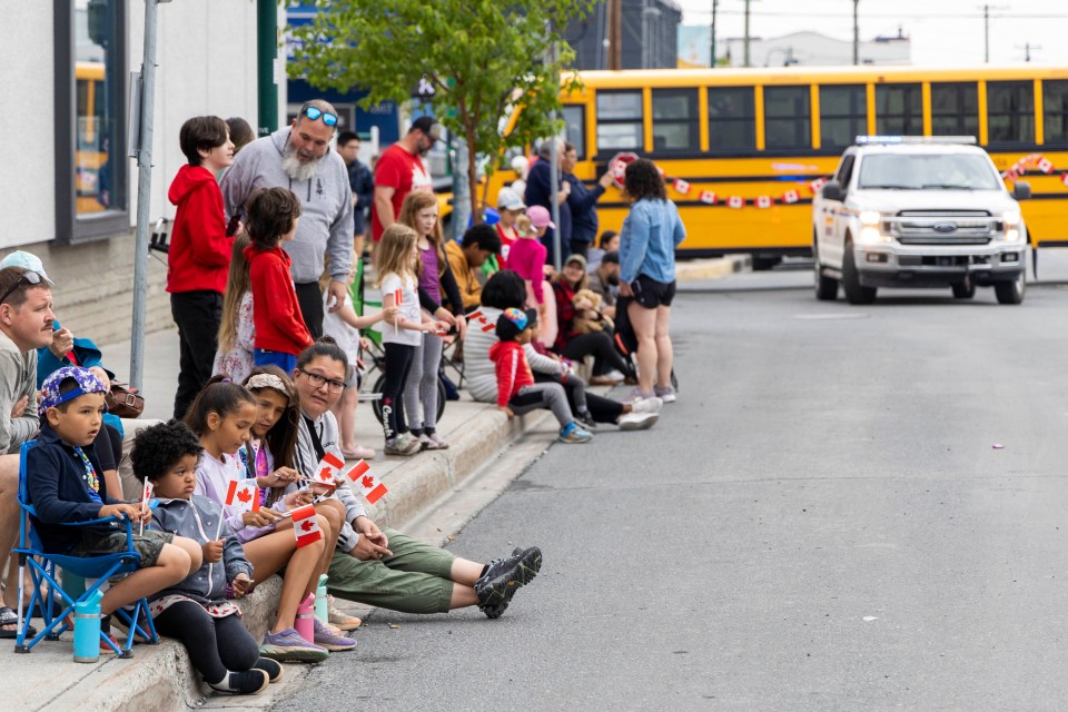 Residents await the start of the parade.