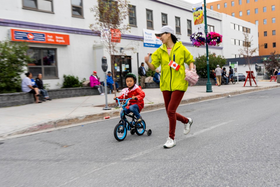 One of the Canada Day Mile's youngest entrants decides to use alternative means of transportation.