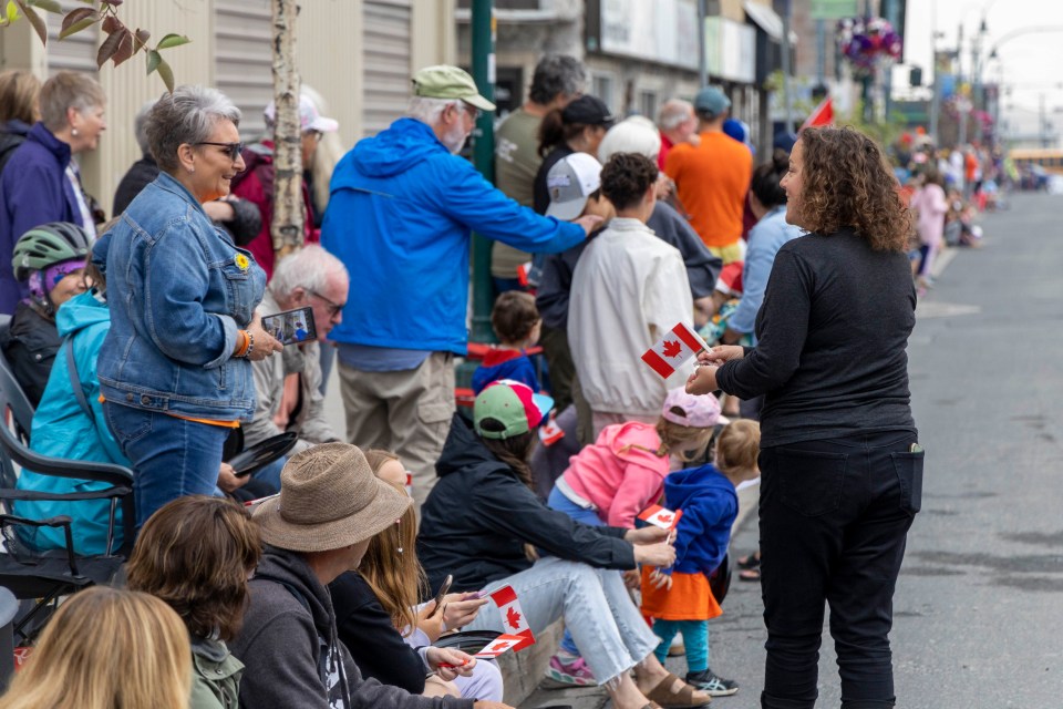 Yellowknife's mayor, right, chats to residents.