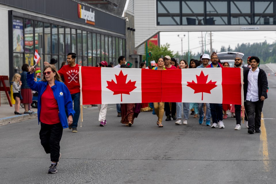 Parade participants start the route outside the downtown Independent.