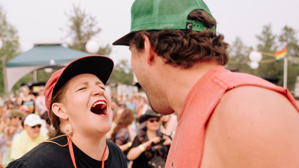 Festival goers sing and dance during Yellowknifer Brenden MacIntosh's set. Sarah Pruys/Cabin Radio