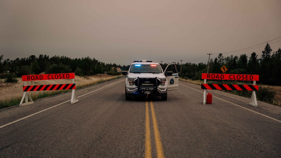 A roadblock on Highway 3 on the evening of July 25, 2023. Sarah Pruys/Cabin Radio