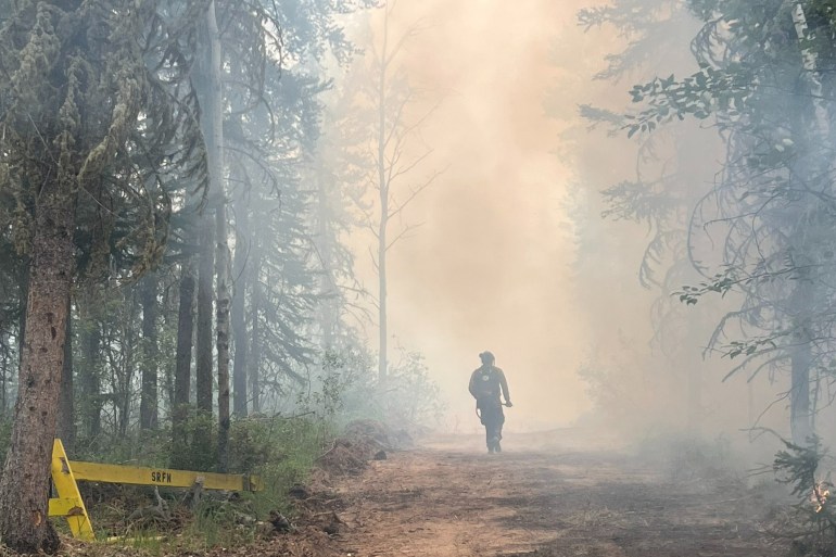 A firefighter working on the Fort Smith fire. Photo: Wood Buffalo National Park