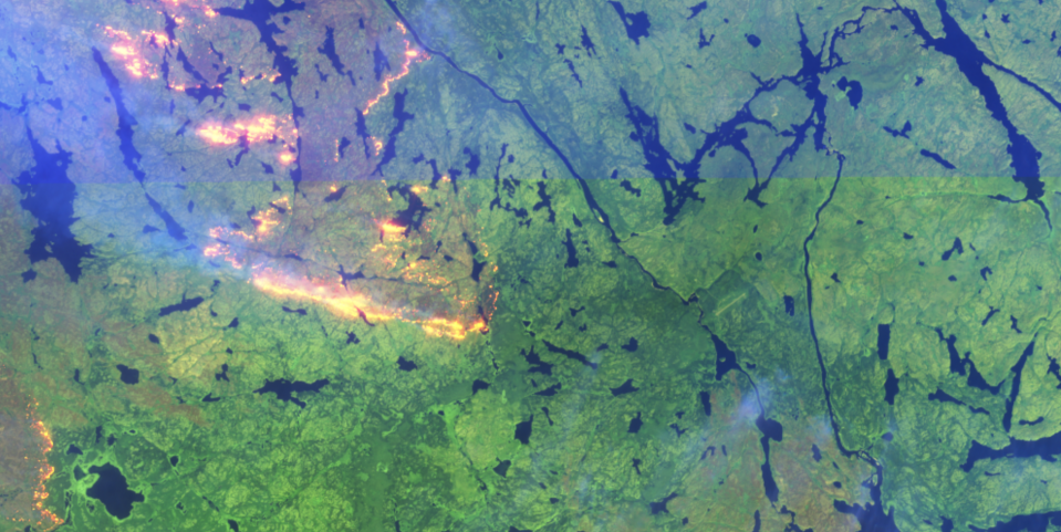 A false-colour Sentinel-2 image shows wildfires burning near the Taltson hydro facility. The dam's airstrip is visible as a thin line on the right-hand side of the image.