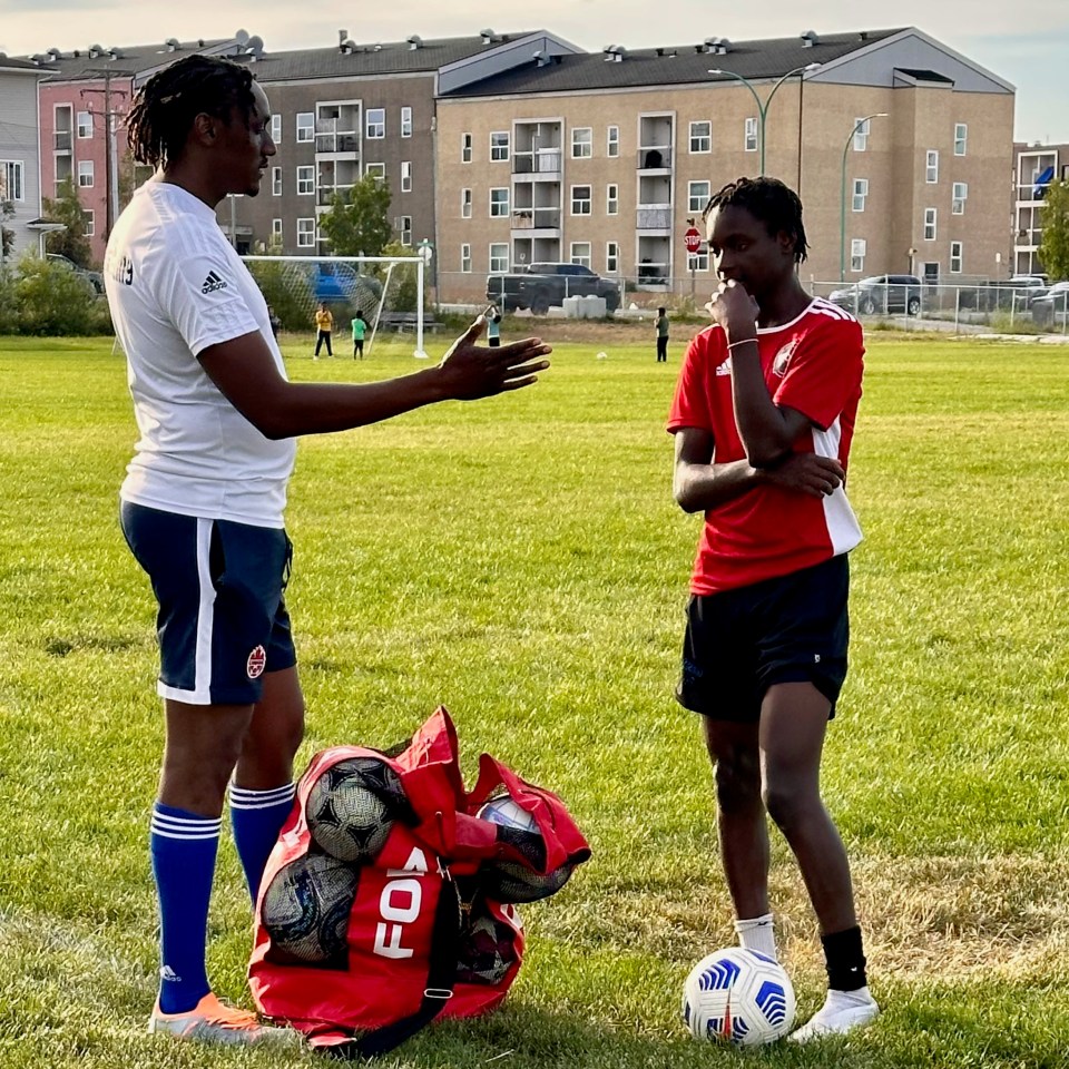 YK Galaxy coach Dillon Torindo, left, with Tanaka Muwirimi. Photo: Supplied