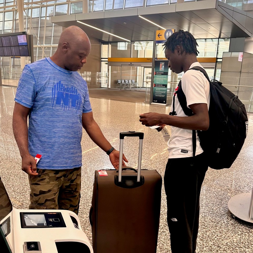 Tanaka Muwirimi with his father at the airport heading to London. Photo: Supplied