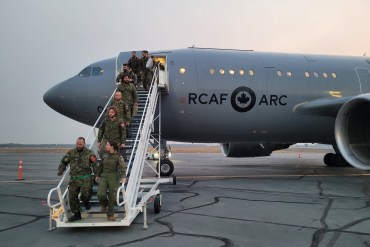 Members of the military arrive in Yellowknife. Photo: Sean Fowler
