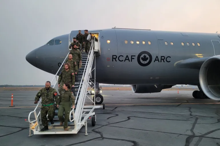 Members of the military arrive in Yellowknife. Photo: Sean Fowler