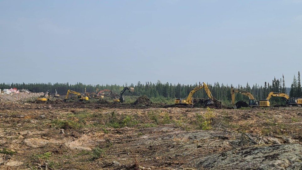 Excavators work on a fire break in Yellowknife. Chris Greencorn/Facebook
