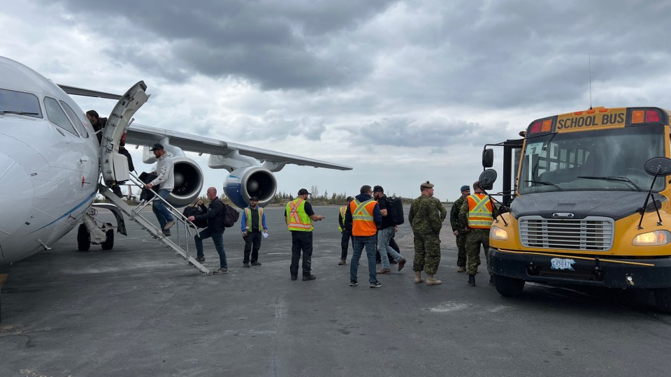 Evacuees board a Summit Air flight to Calgary on August 18, 2023. Photo: Trung Bui