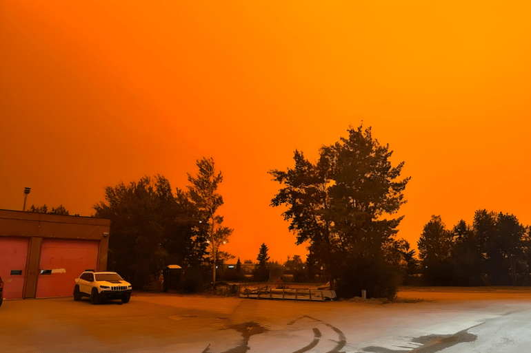 An undated image of Hay River where the sky has turned orange from the nearby wildfires. Stacey Barnes/Town of Hay River