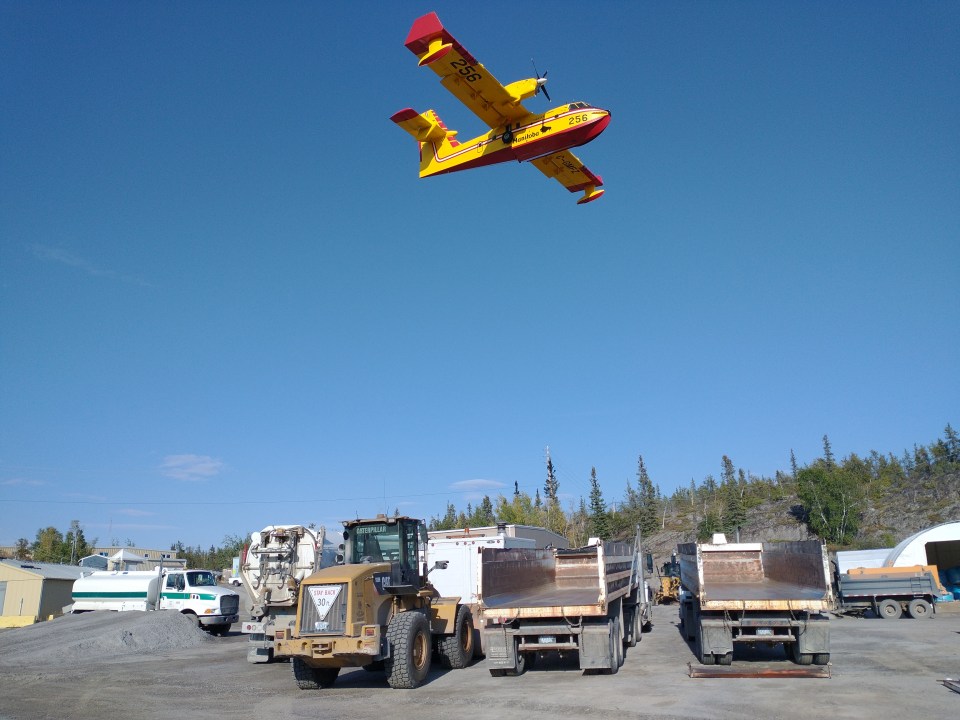 A water bomber collects water from Kam Lake. Photo: Dwayne Wohlgemuth