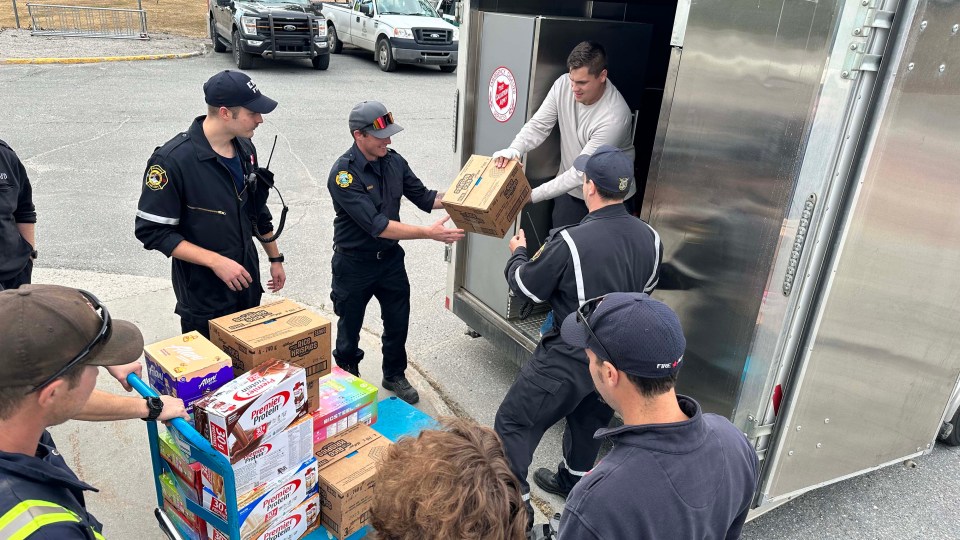 Salvation Army staff and volunteers unload food from their refridgerated truck and mobile kitchen in Yellowknife. K Johnson/Salvation Army