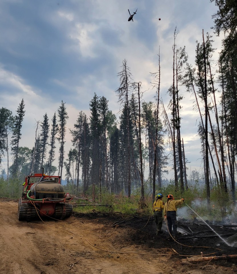 Fire crews put out hot spots. Wood Buffalo National Park/Facebook
