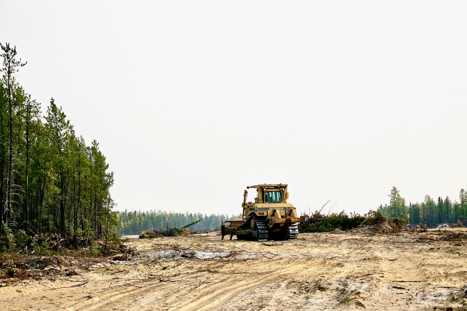 A piece of heavy machinery in a fire break outside Yellowknife on September 12, 2023. Ollie Williams/Cabin Radio