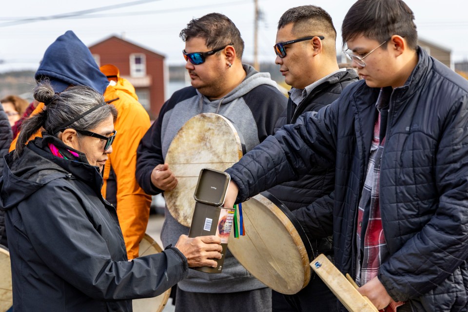 Tobacco is handed out during a feeding-the-fire ceremony on September 30, 2023.