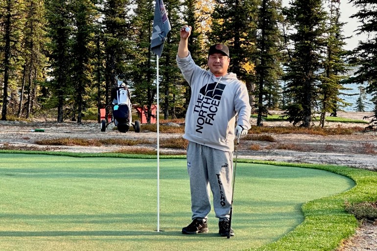 Robert Judas after scoring Wekweètì's first hole-in-one. Photo: Submitted